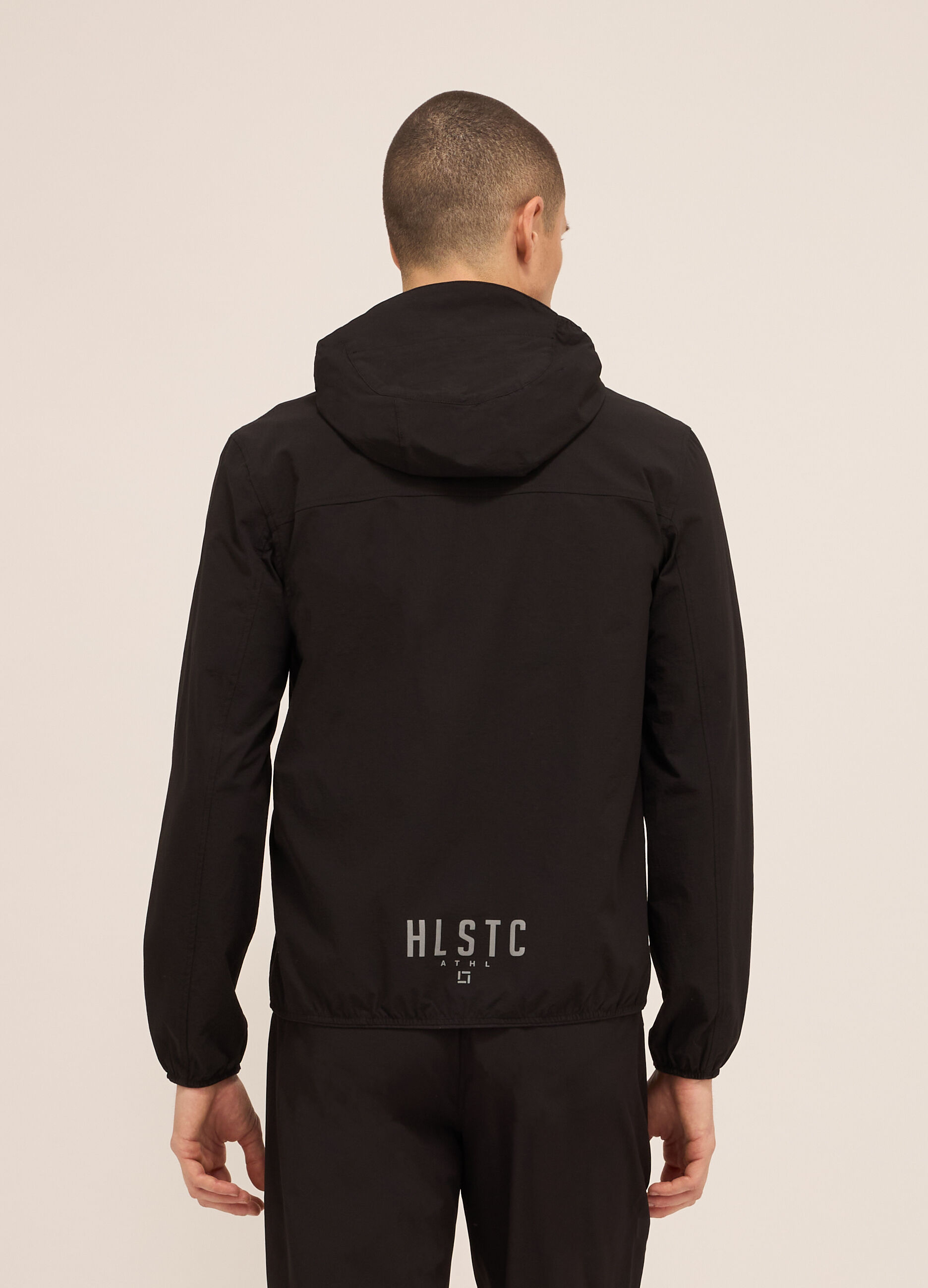 Giacca a vento in tessuto tecnico con zip e cappuccio uomo