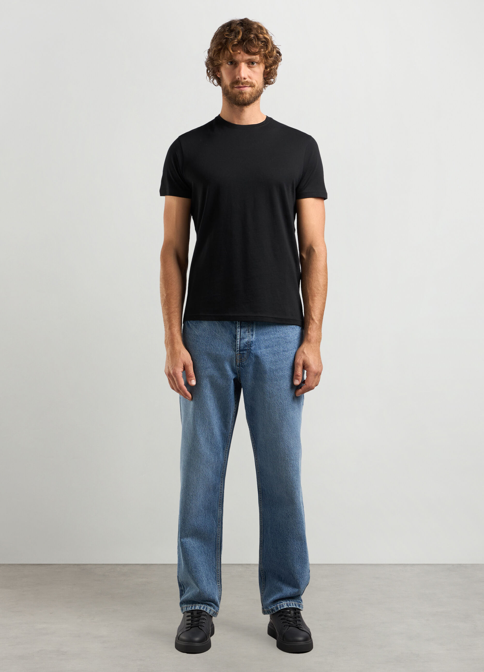 Jeans loose fit in denim di puro cotone uomo_0