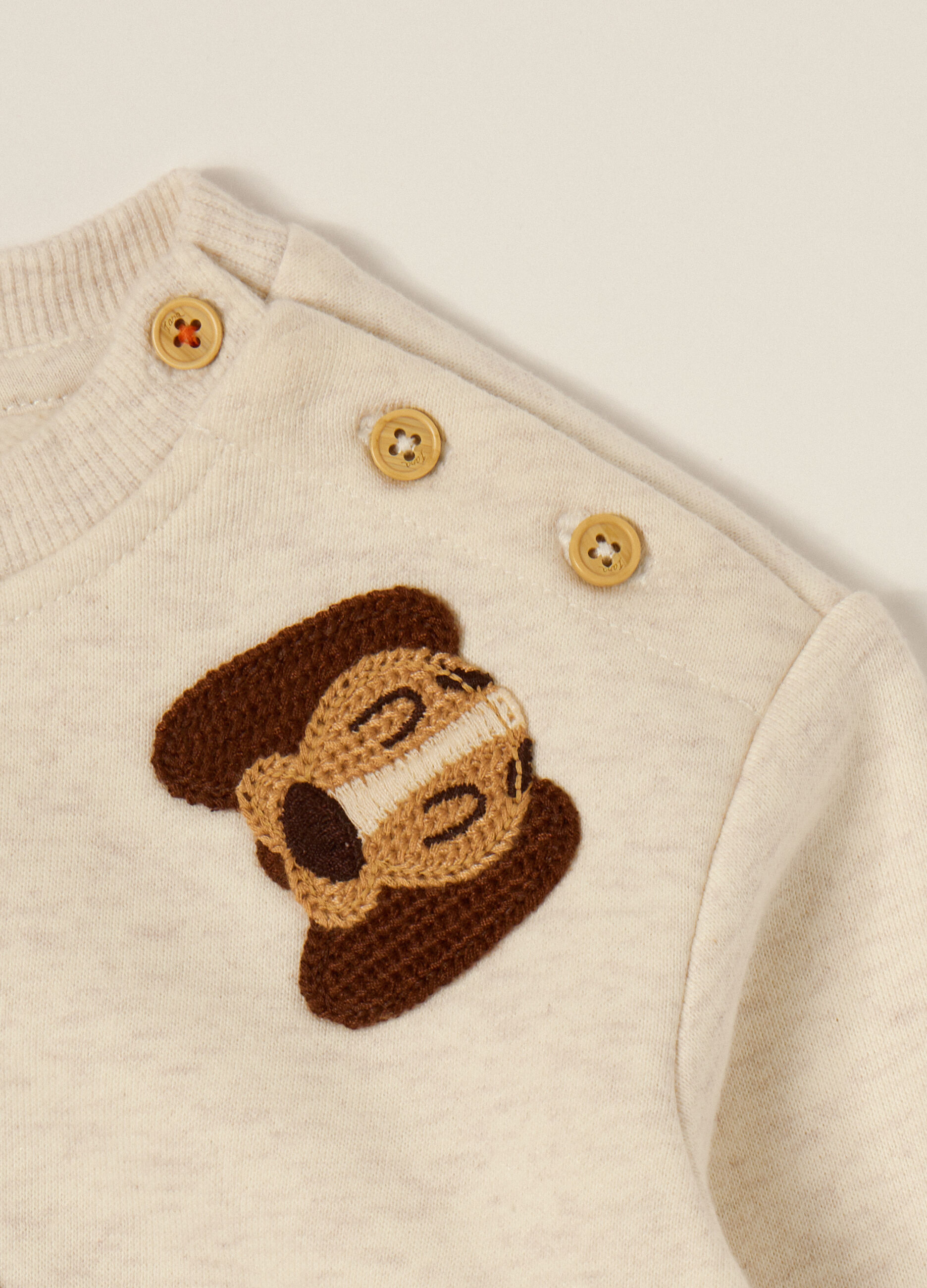 Maglia beige con applicazioni di cagnolini_2