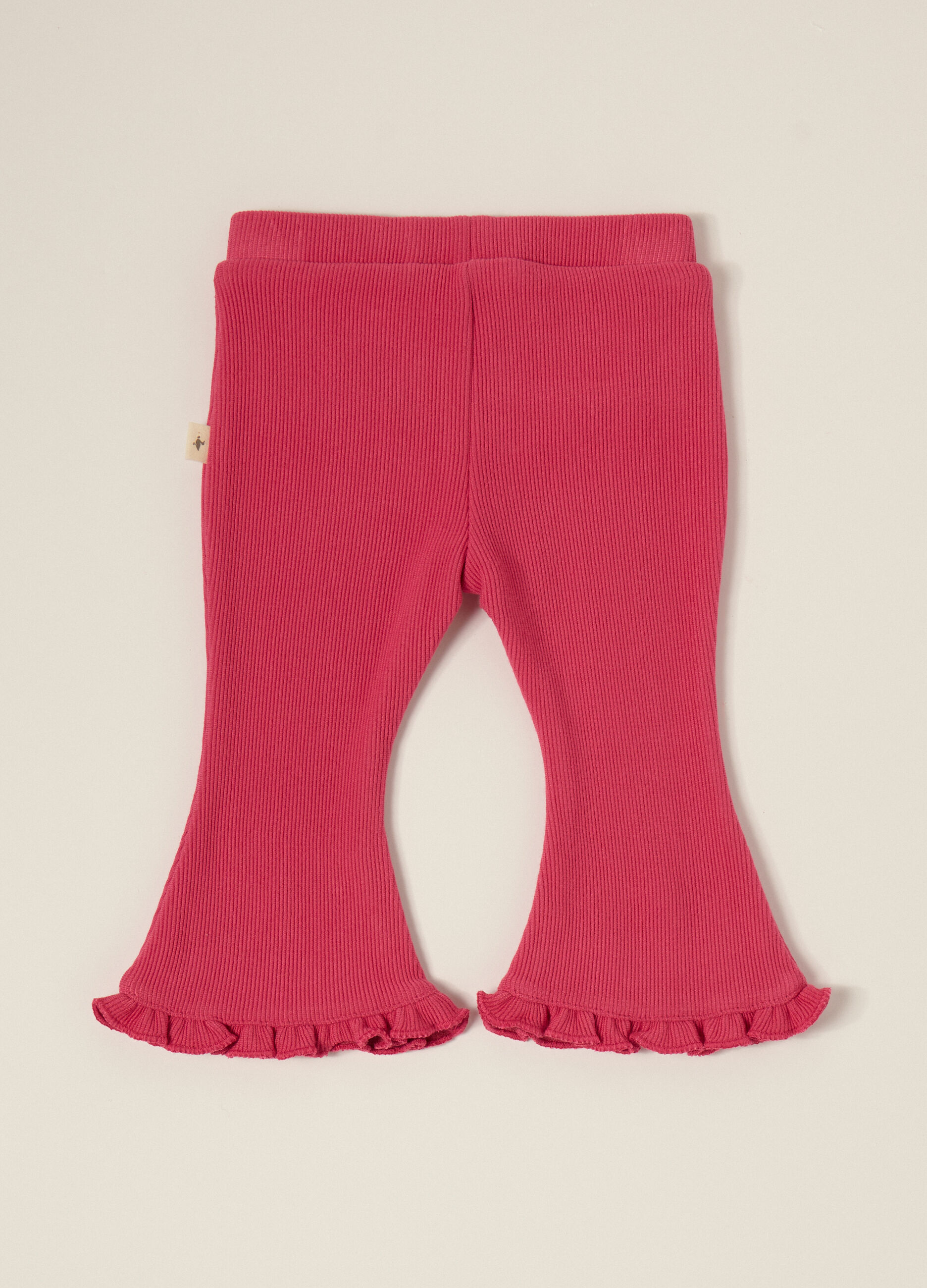 Pantaloni rosa elasticizzati con volant_0