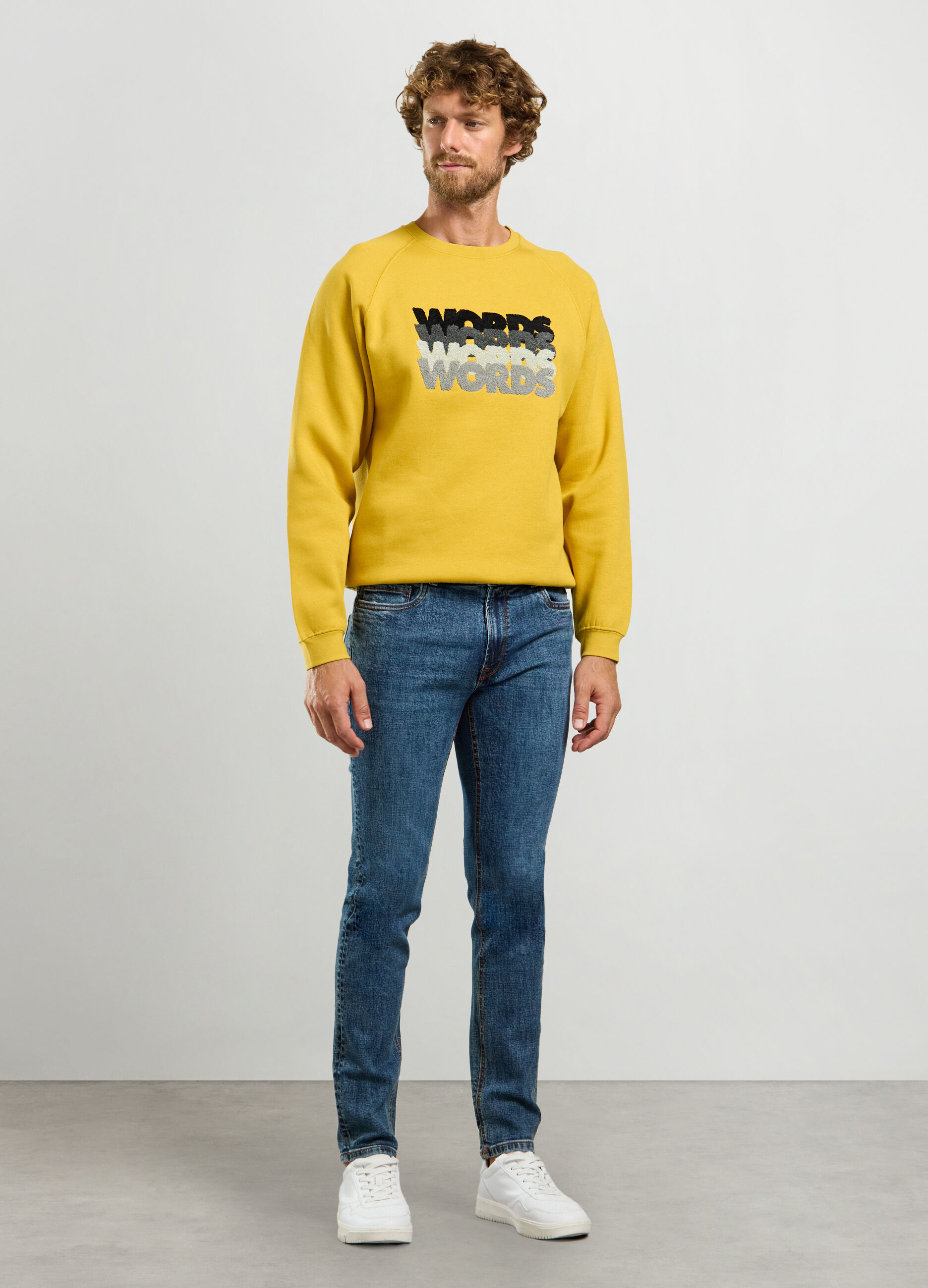 Jeans slim fit in denim di cotone stretch uomo_0