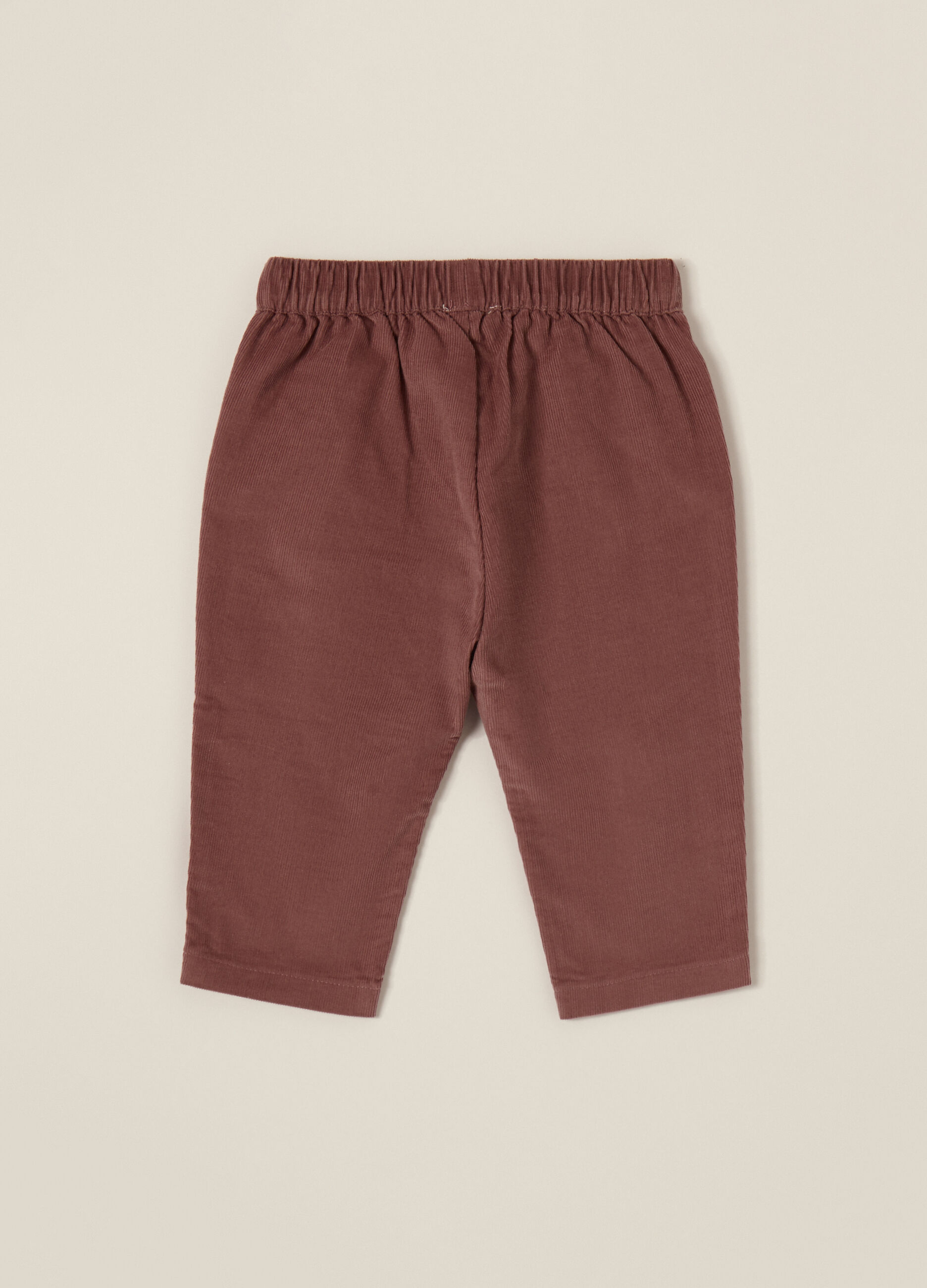 Pantaloni rosa in velluto a coste per bambina_1