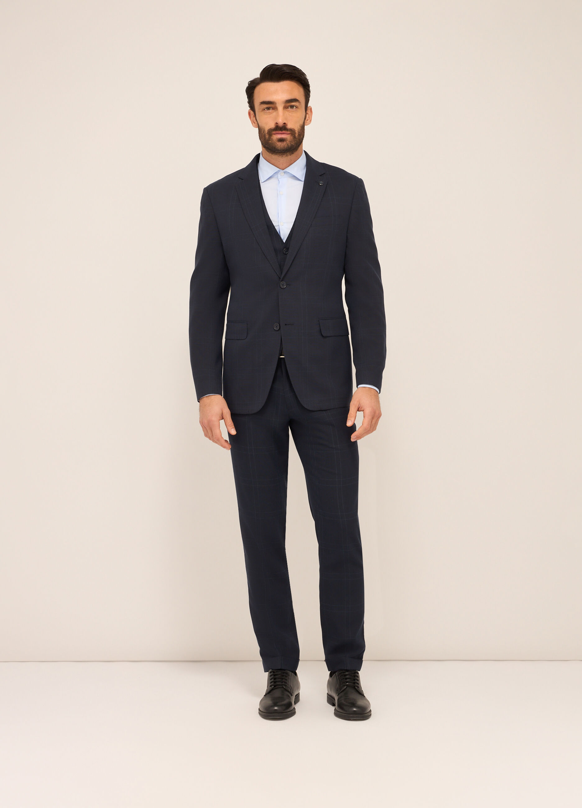 Gilet con bottoni in tessuto stretch a quadri uomo_0