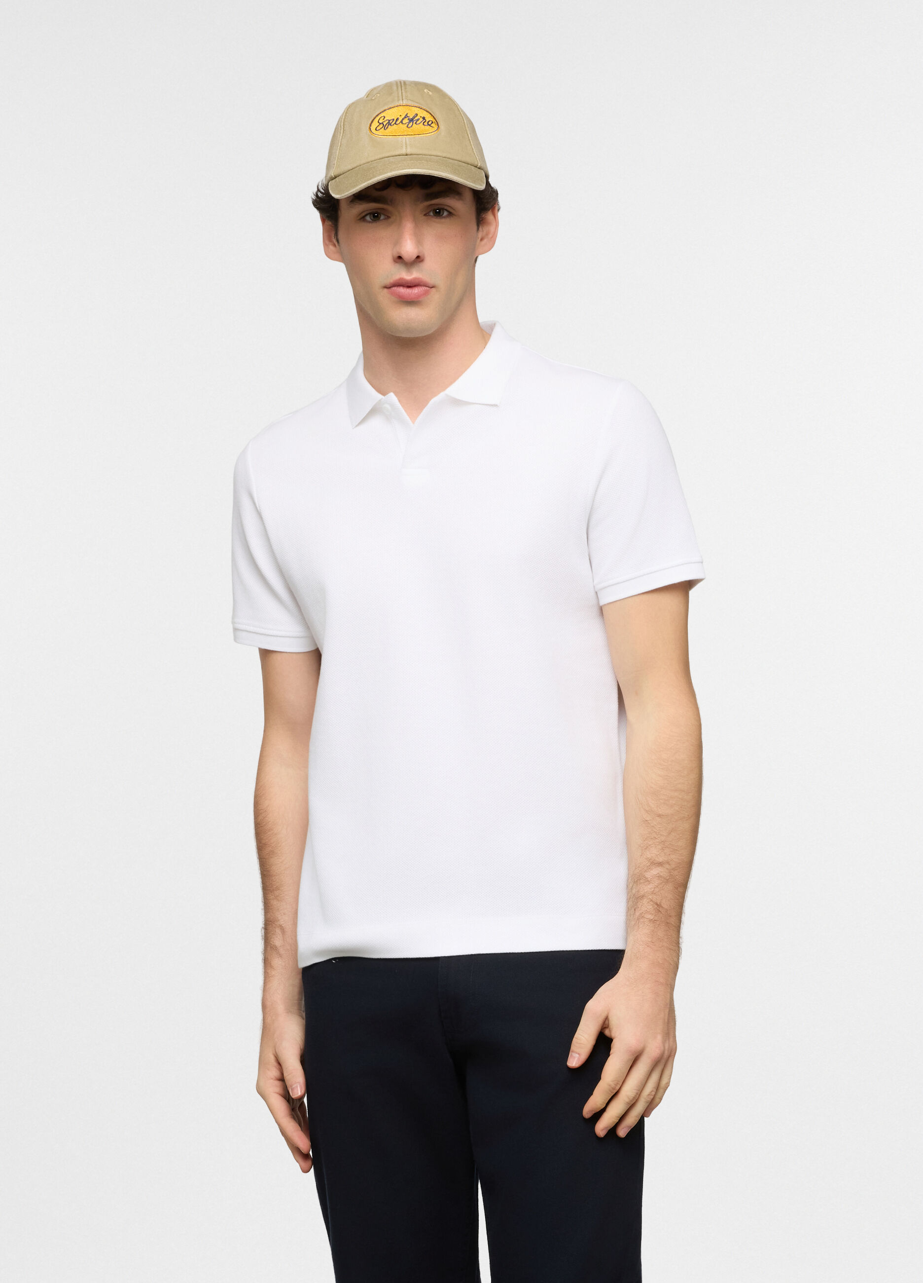 Polo a maniche corte in cotone con allacciatura seminascosta uomo_0